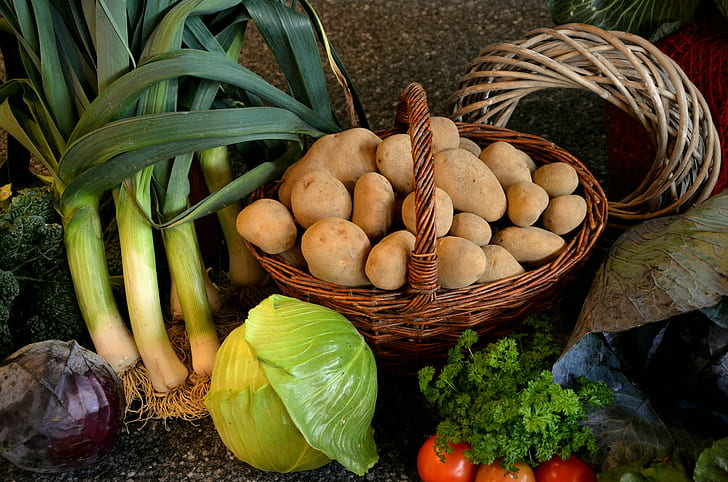 basket of potatoes beside cabbage
