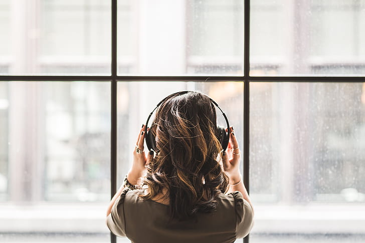 woman in the window while listening music