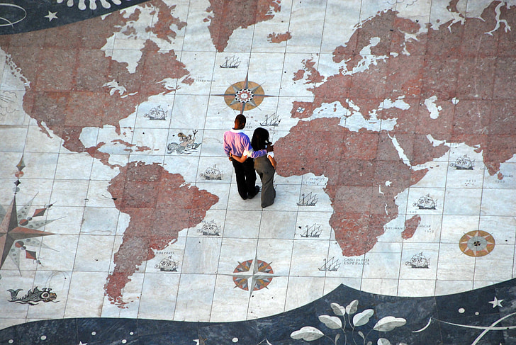 man and woman standing on white and brown map painted floor