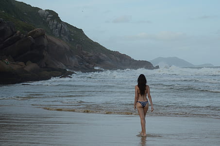 woman in gray bikini standing near shore