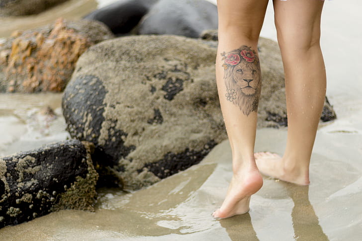 Person With Lion Tattoo
