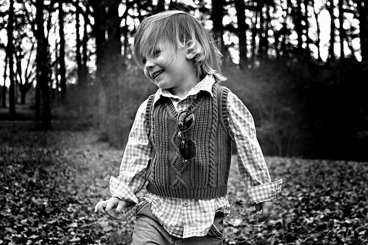 grayscale photography of child playing