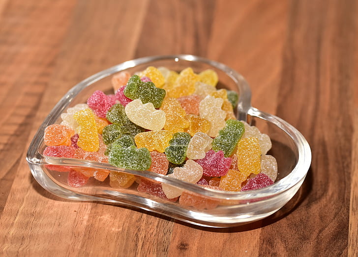 gummy bear candies in glass heart bowl