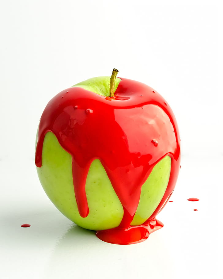 granny smith apple with red paint