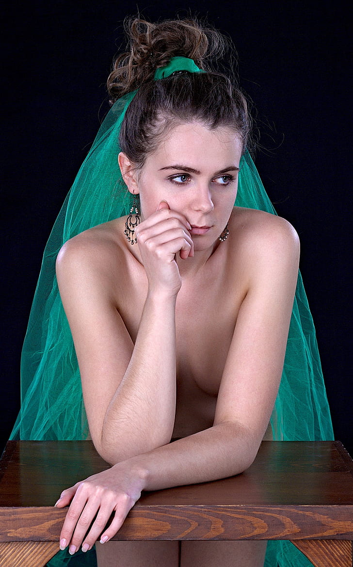 woman wearing green veil