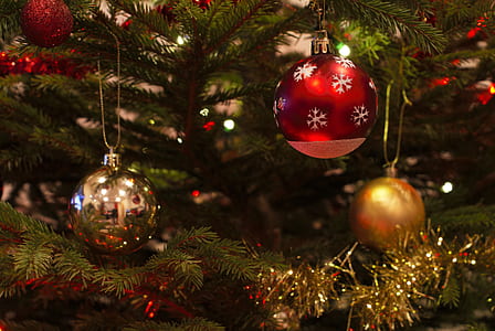 red, gray, and gold baubles on Christmas tree