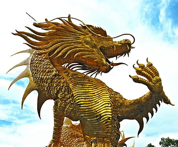 gold dragon guardian under cloudy sky