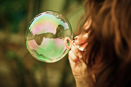 Girl Blowing a Bubble