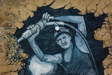 man holding jack hammer painting