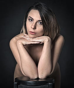 woman leaning on side table