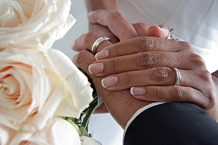 man and woman wearing band rings