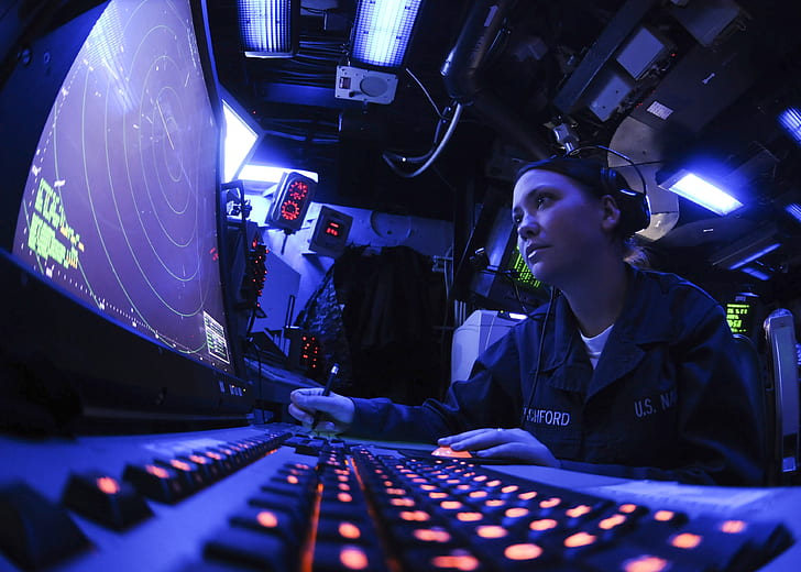 woman operating radar monitoring system