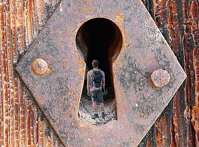 man standing inside the keyhole