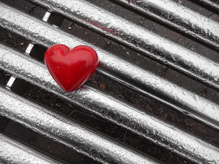 red heart on gray metal board