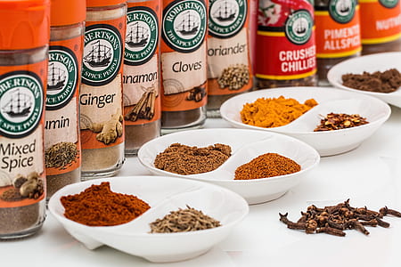 different spices on plates
