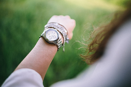 Silver watch on the girl's arm