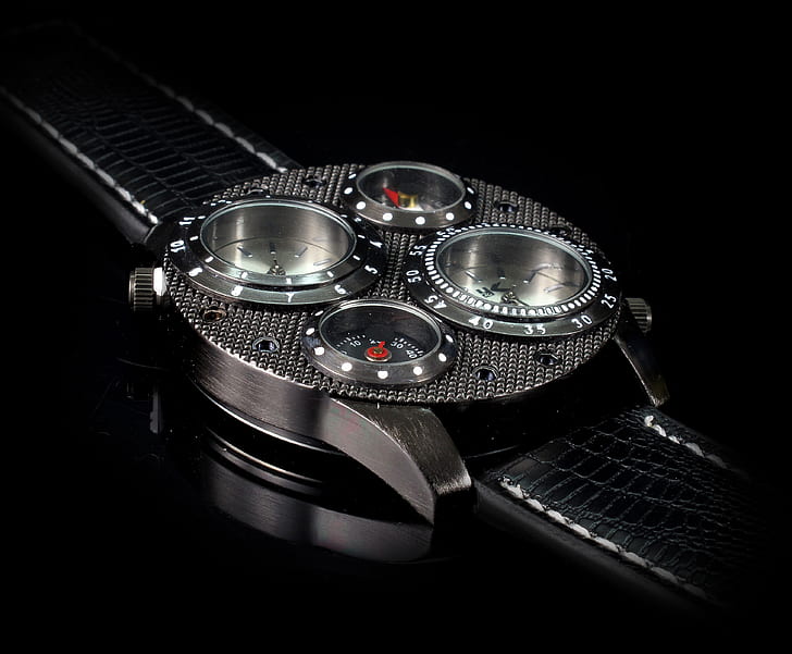 photo of black and silver analog watch