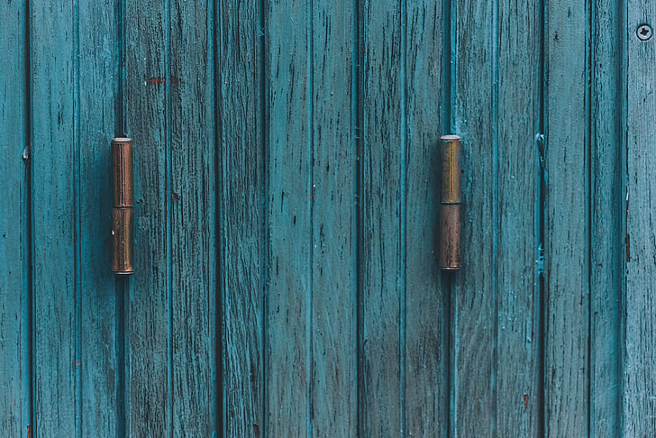 teal wooden door with hitch
