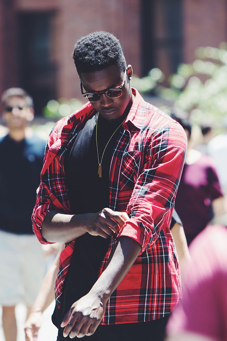 man in black, red, and white plaid sports shirt