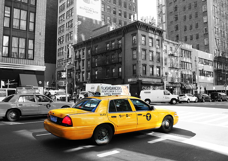 yellow taxi on road