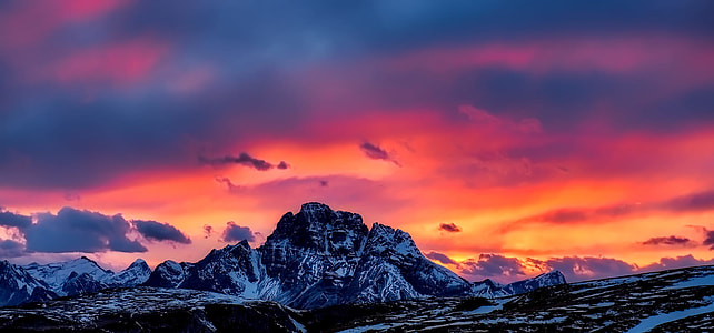 panoramic photography of mountain coated by ice under golden hour