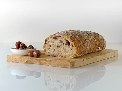 Bread on Top of Brown Wooden Chopping Board
