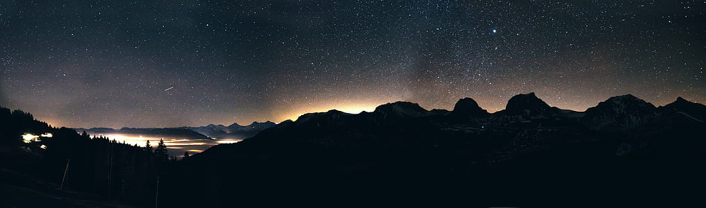 mountains under starry sky