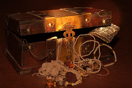 jewelries on brown wooden chest box