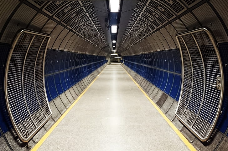photo of blue and grey tunnel during daytime