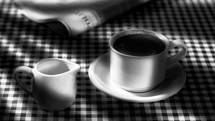 grayscale photography of teacup with saucer beside pitcher