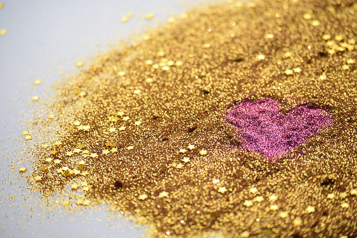 gold and pink glitter scattered on the floor