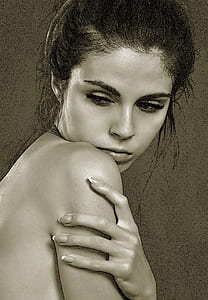 grayscale photography of a topless woman holding her right shoulder