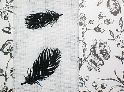 white and black floral textile