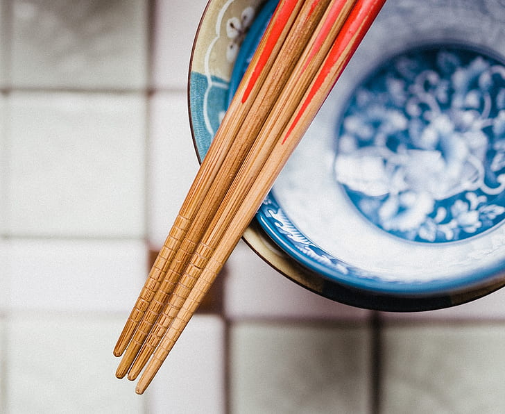 closeup photo of four chopsticks