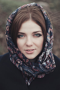 woman in blue, white, and red floral scarf