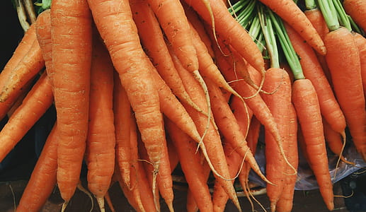 shallow focus photography of carrot lot