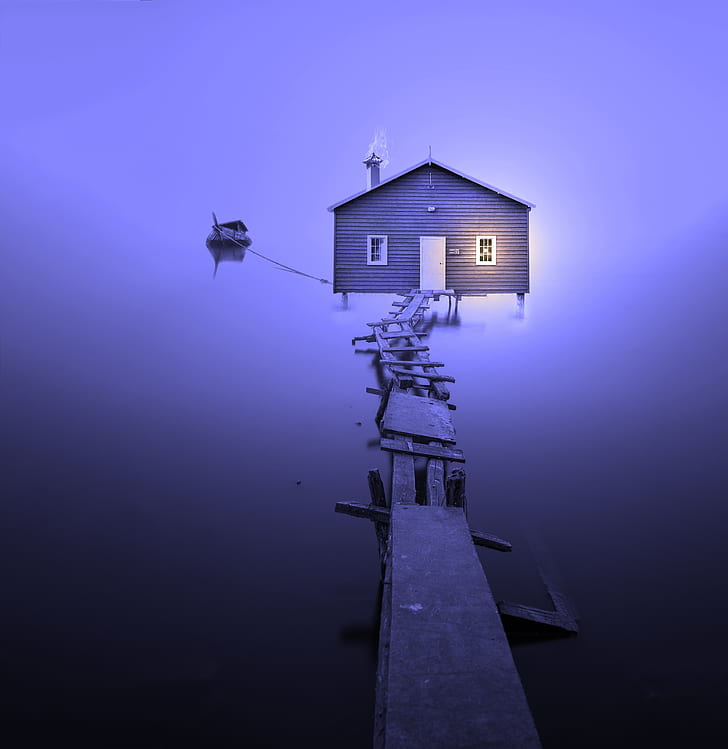 brown wooden house with wooden dock under purple sky