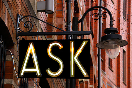 black ASK lighted signage with lamp