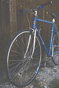 Blue City Bike Beside Brown Wooden Fence