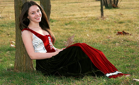 woman wearing red and white sleeveless maxi dress