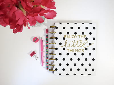 white and black notebook