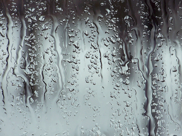 water flowing on glass window