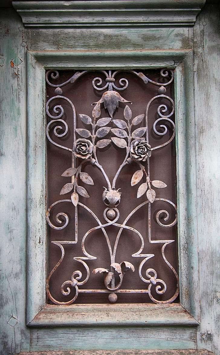 closeup photo of brown and gray floral grille