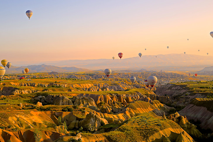 aerial view of hot air balloons on the sky during day time