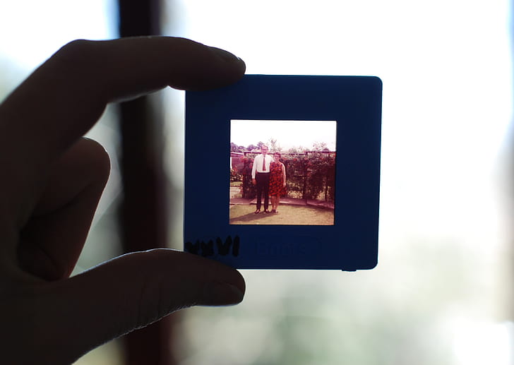 person holding photo frame