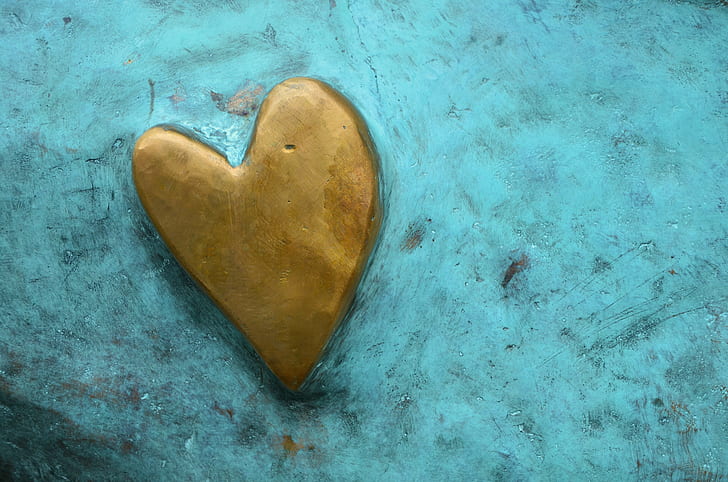 brown heart logo on teal board
