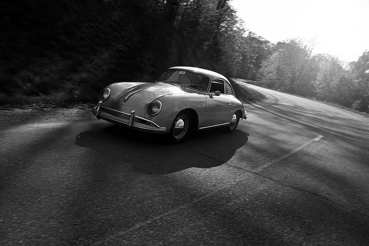 grayscale photo of classica car on road