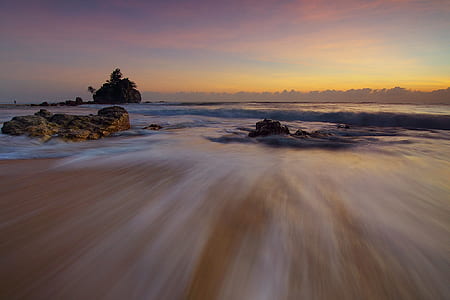 timelapse photograph of low tide sea during golden hour