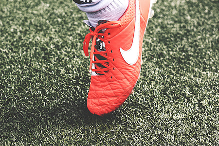 orange Nike soccer cleats