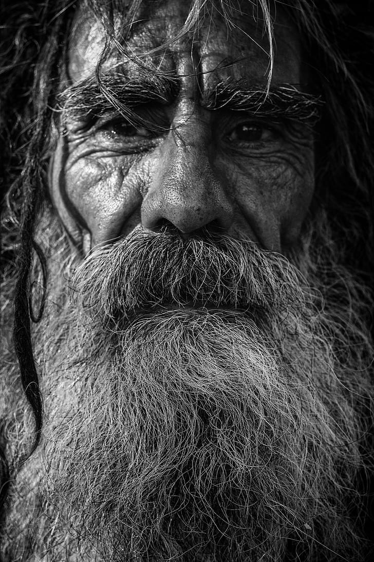grayscale photo of man wit beard